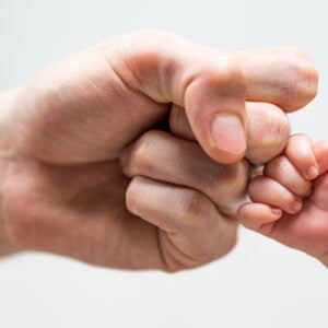 Manos de papá e hijo Manos de papá e hijo